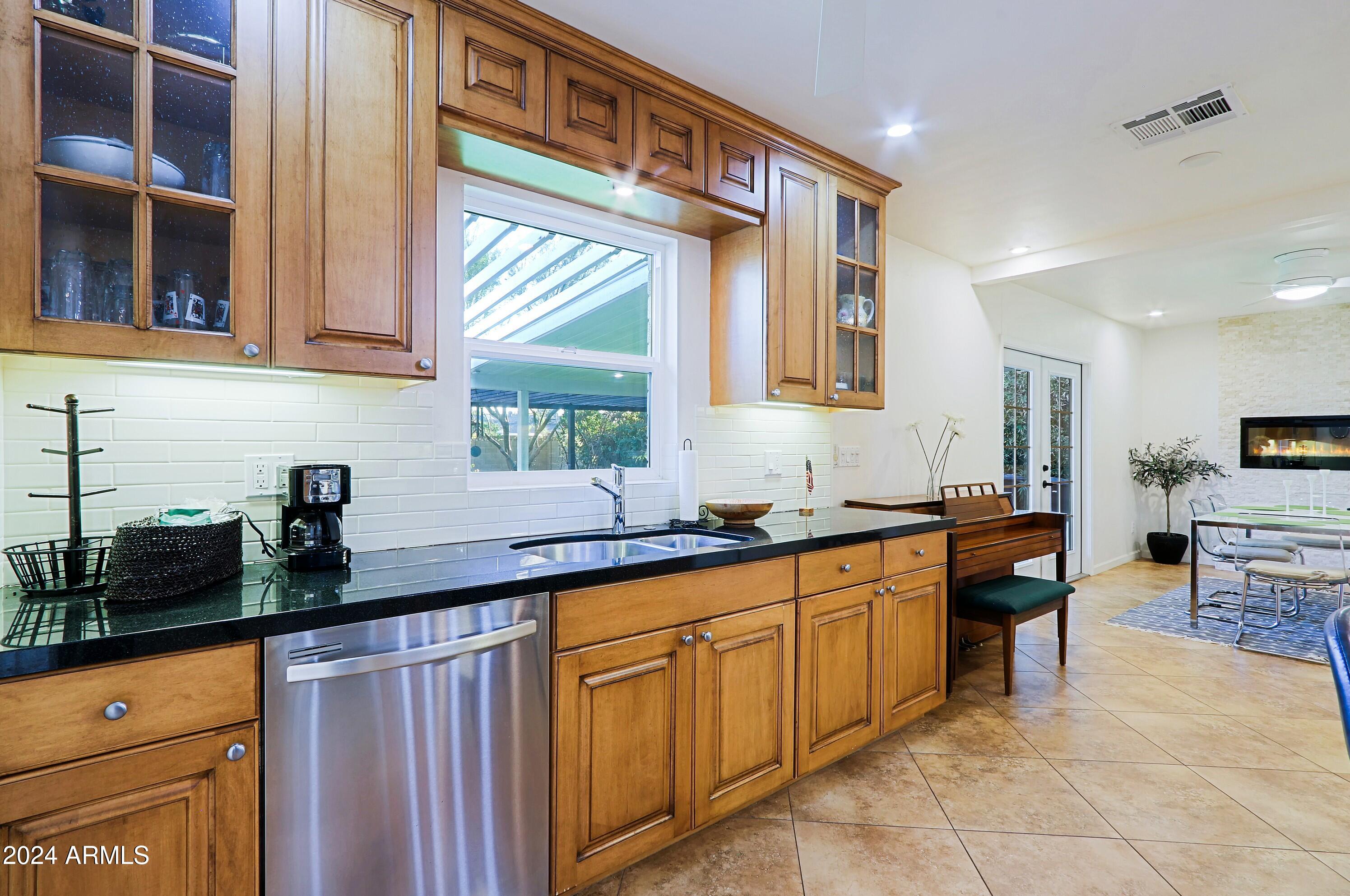 4645 East Windsor Avenue Phoenix, AZ 85008 - Photo 12 of 33 a kitchen with a sink and cabinets