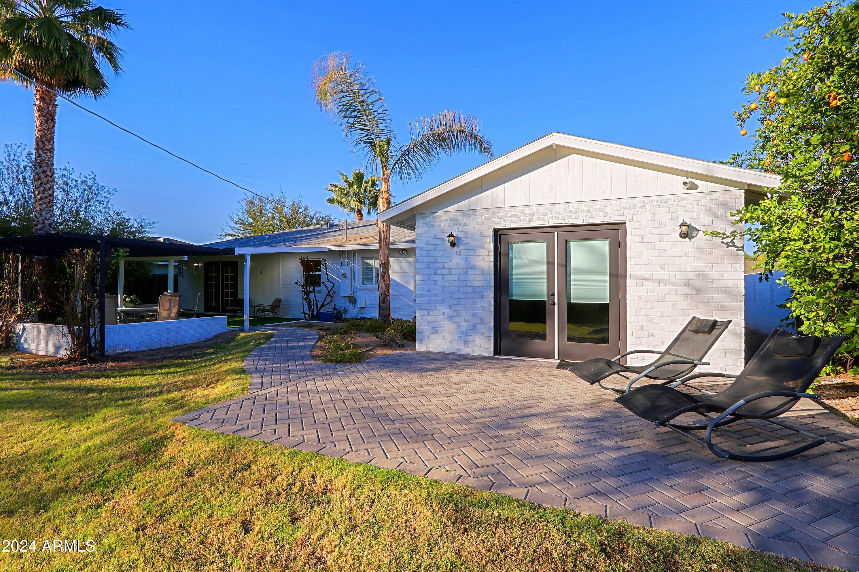 4645 East Windsor Avenue Phoenix, AZ 85008 - Photo 16 of 33 a view of a house with backyard porch and sitting area