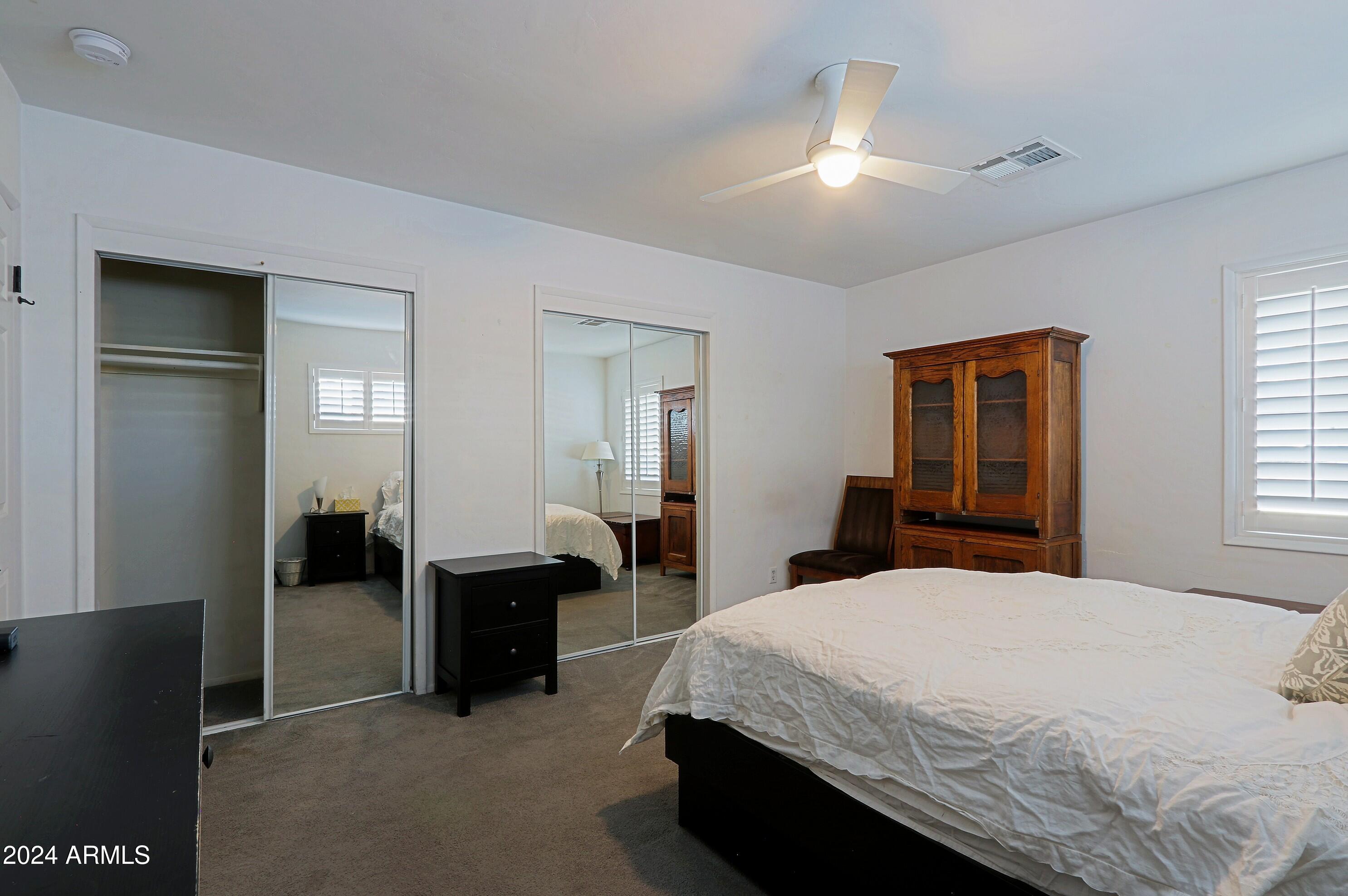 4645 East Windsor Avenue Phoenix, AZ 85008 - Photo 22 of 33 a bedroom with a bed and a walk in closet