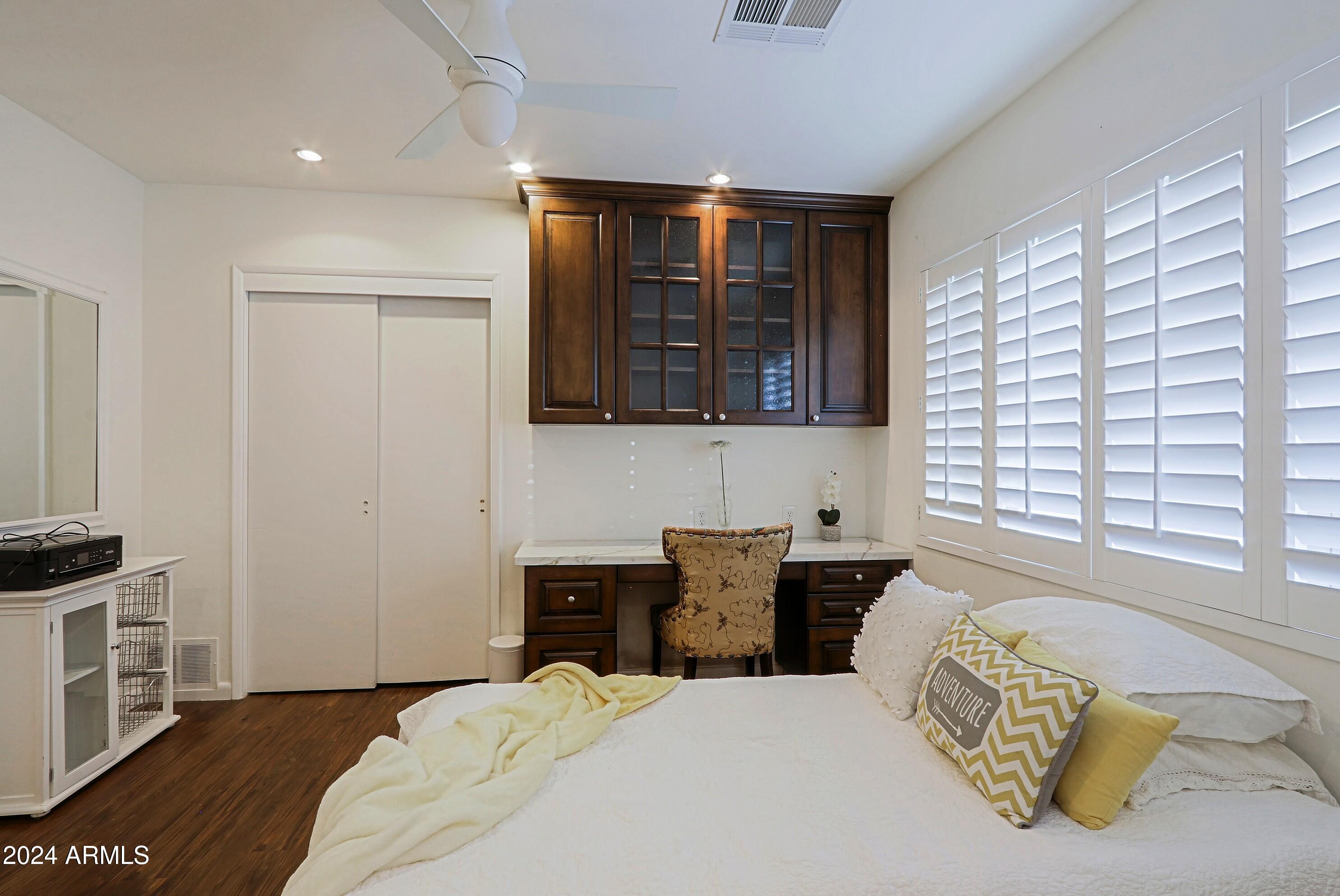 4645 East Windsor Avenue Phoenix, AZ 85008 - Photo 26 of 33 a bedroom with a bed and a window