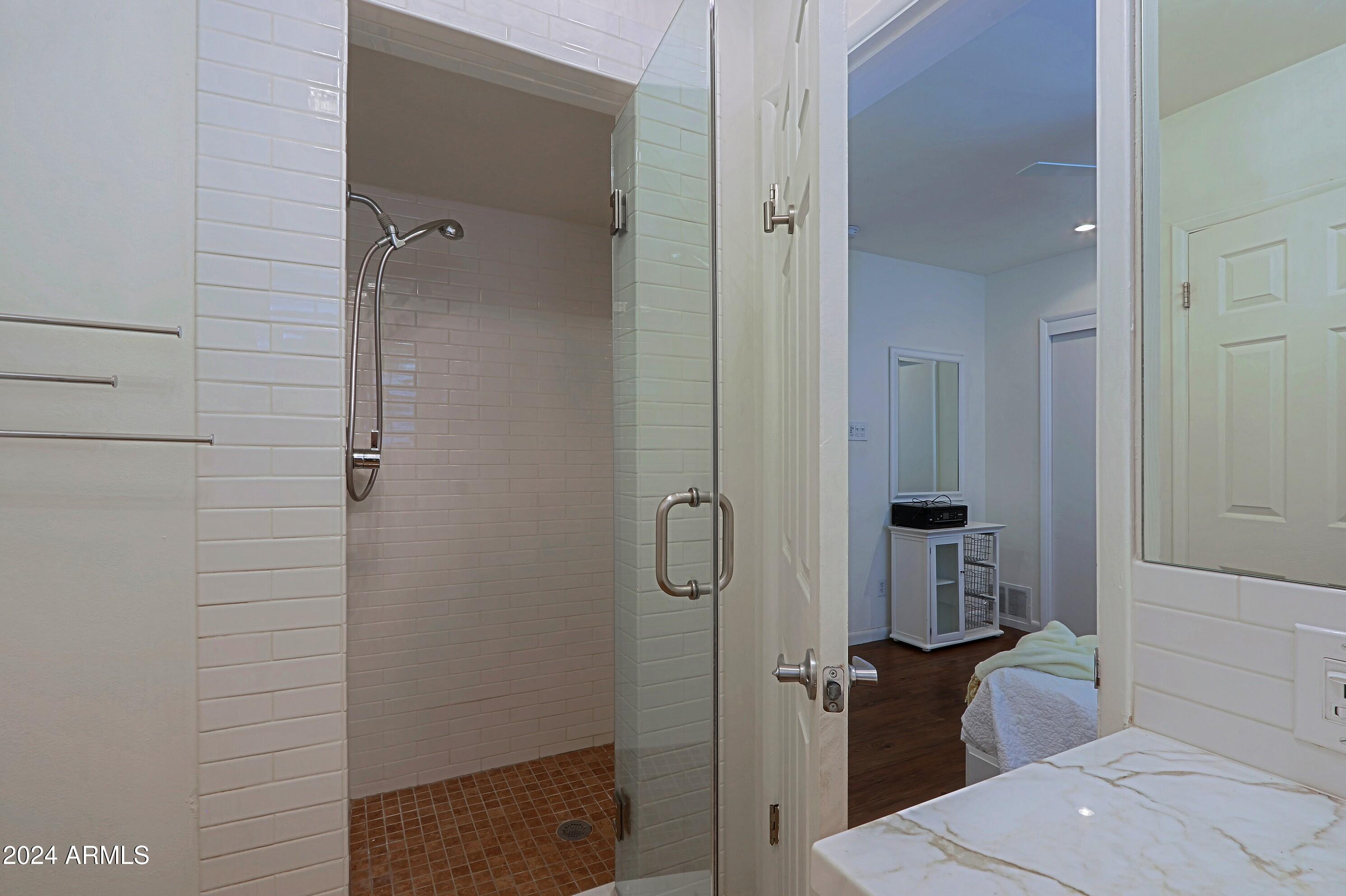 4645 East Windsor Avenue Phoenix, AZ 85008 - Photo 28 of 33 a bathroom with a granite countertop shower