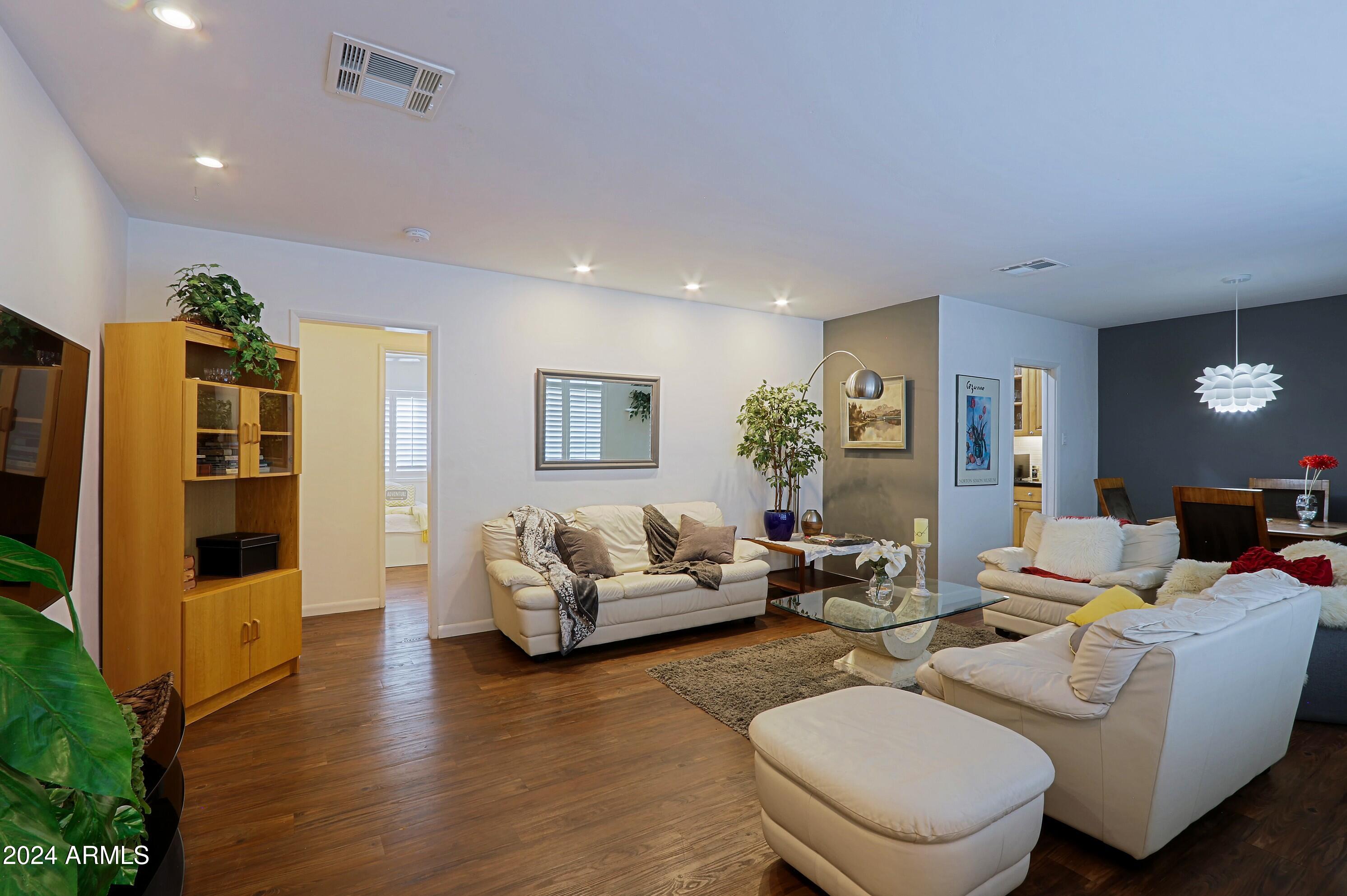 4645 East Windsor Avenue Phoenix, AZ 85008 - Photo 4 of 33 a living room with furniture and wooden floor