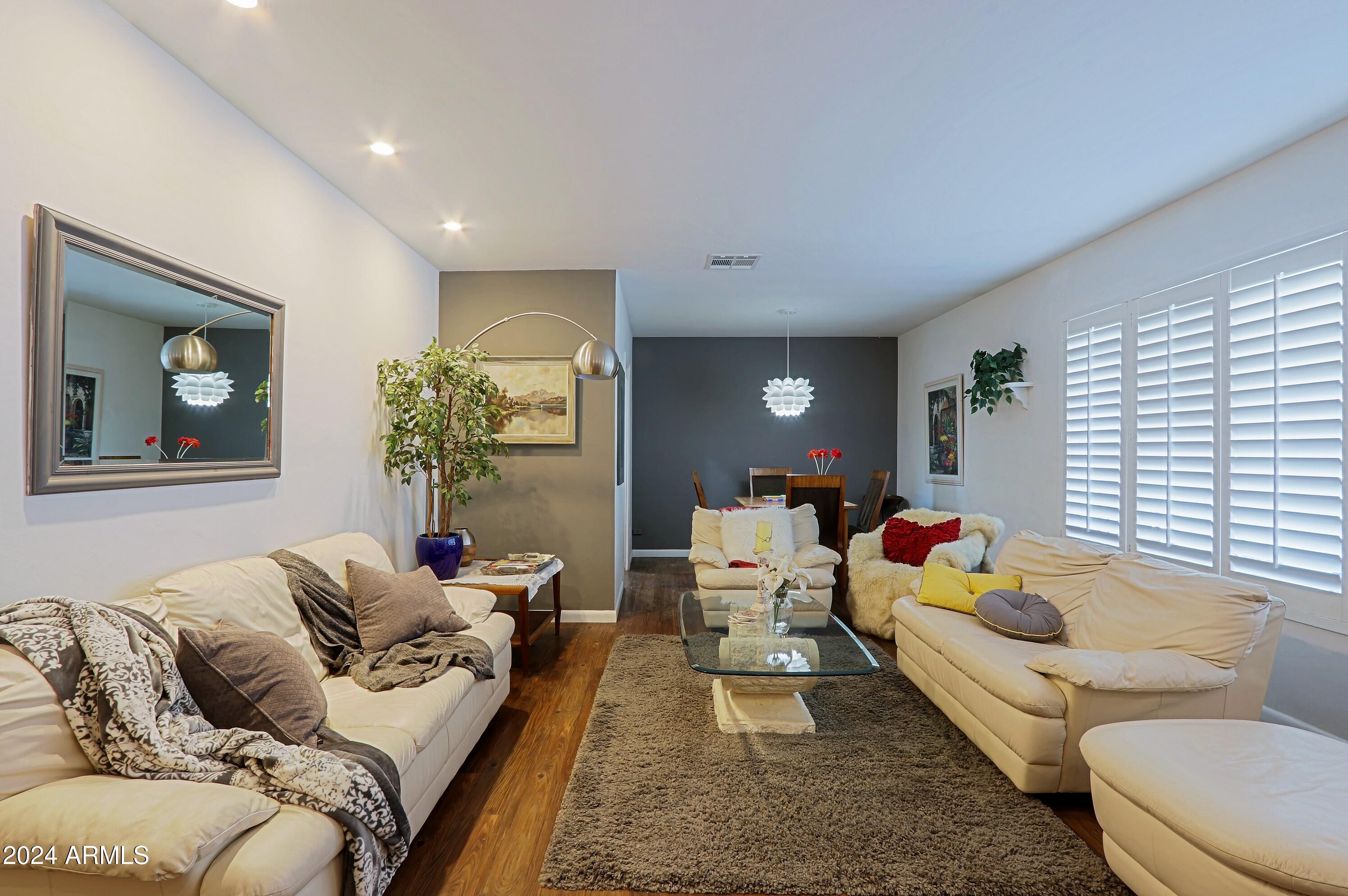 4645 East Windsor Avenue Phoenix, AZ 85008 - Photo 6 of 33 a living room with furniture and a large window