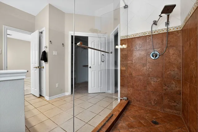 a bathroom with a shower and a sink