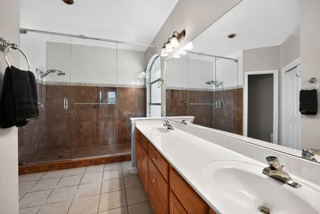 a bathroom with a sink a double vanity and mirror