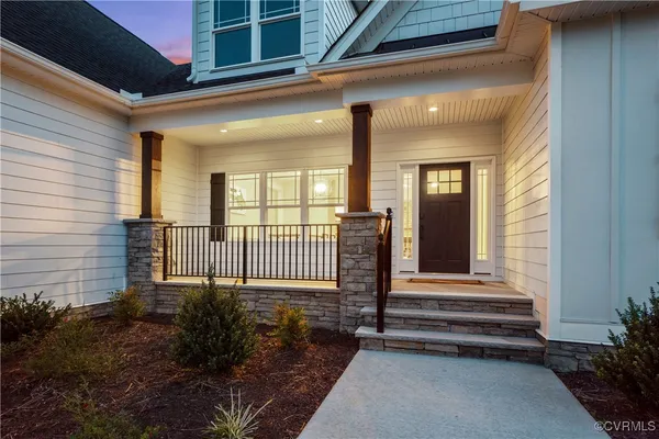 a front view of a house with a porch