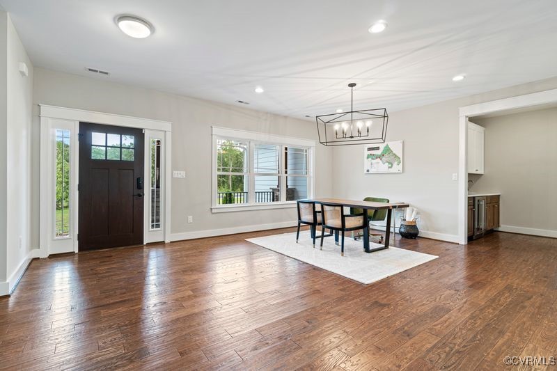 Lot 44 Wendenburg Circle, Unit SPEC Aylett, VA 23009 - Photo 5 of 19 an empty room with furniture a chandelier and wooden floor