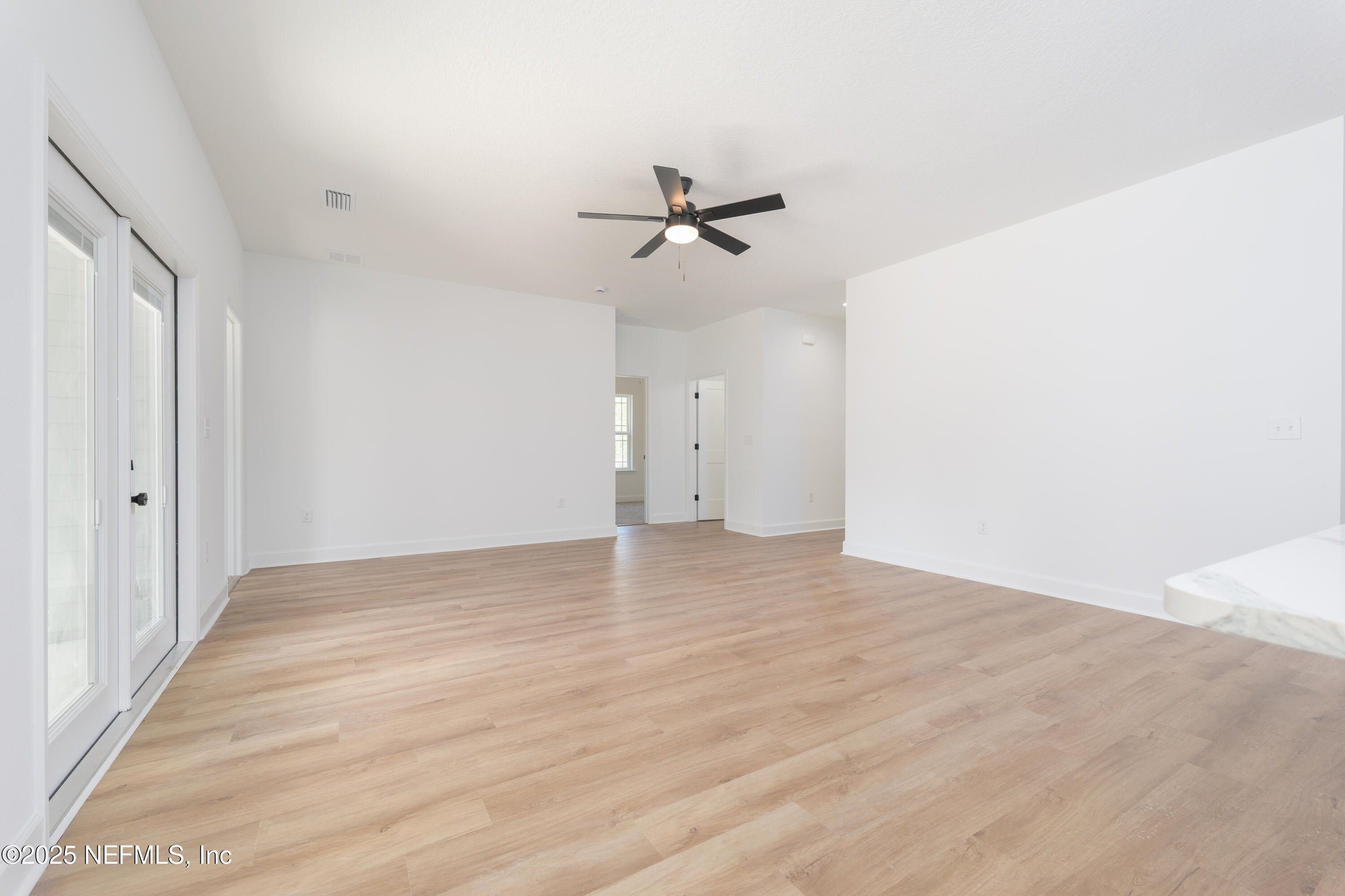 5214 County Road 218 Middleburg, FL 32068 - Photo 14 of 30 wooden floor in an empty room