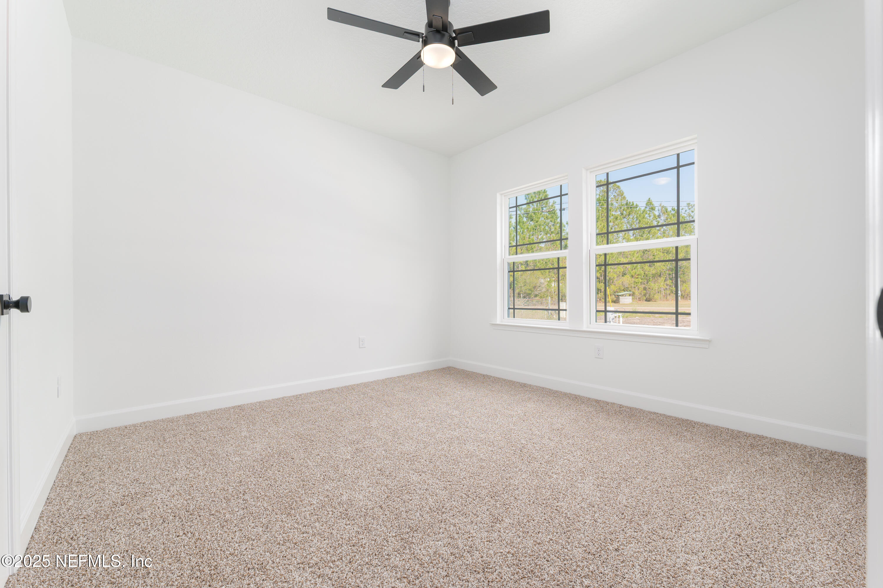 5214 County Road 218 Middleburg, FL 32068 - Photo 18 of 30 an empty room with windows and fan view
