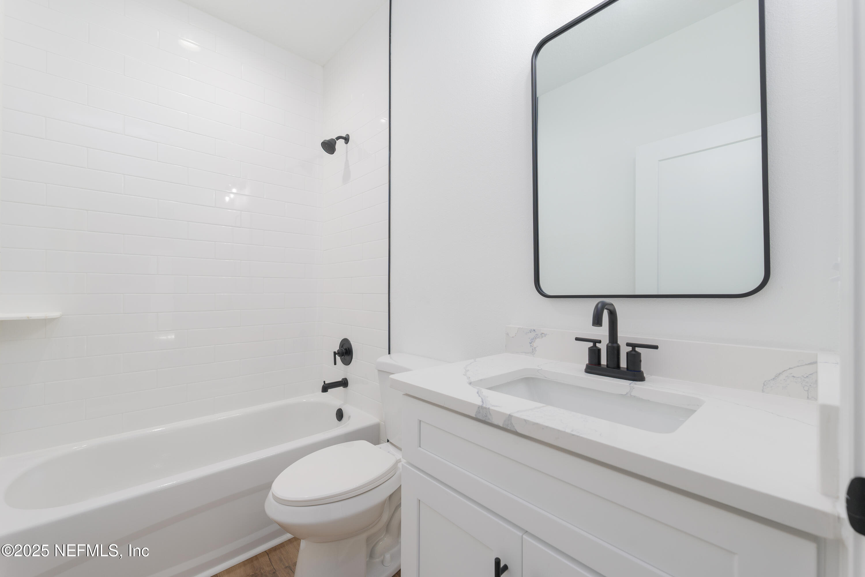 5214 County Road 218 Middleburg, FL 32068 - Photo 26 of 30 a bathroom with a sink a toilet and a mirror