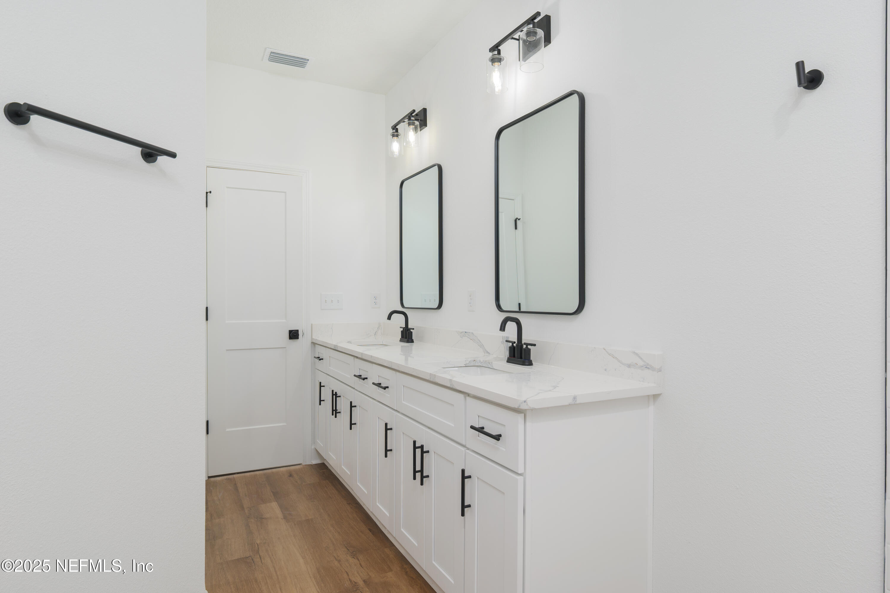 5214 County Road 218 Middleburg, FL 32068 - Photo 27 of 30 a bathroom with double vanity sink and a mirror