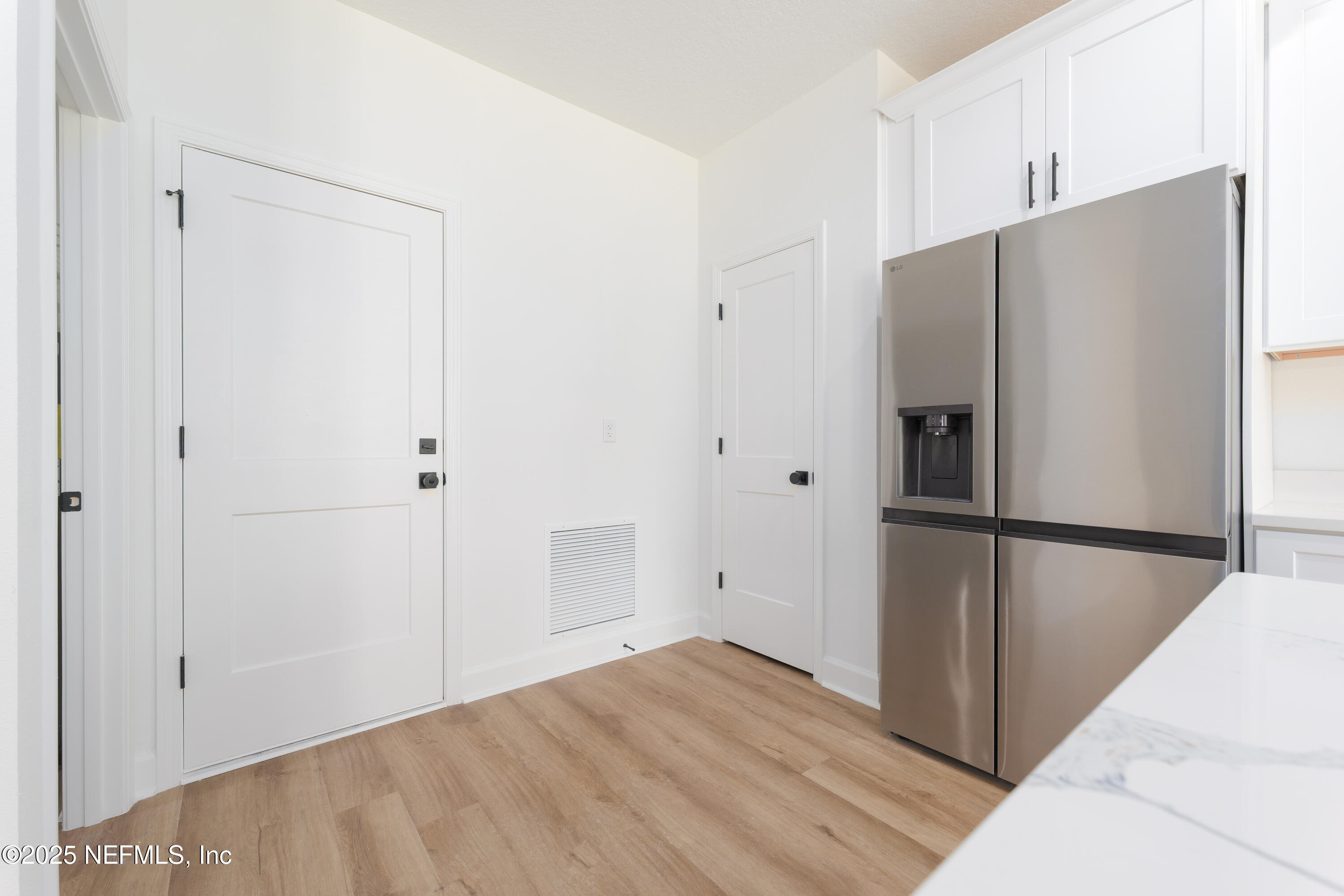 5214 County Road 218 Middleburg, FL 32068 - Photo 9 of 30 a view of a kitchen with a closet and a refrigerator