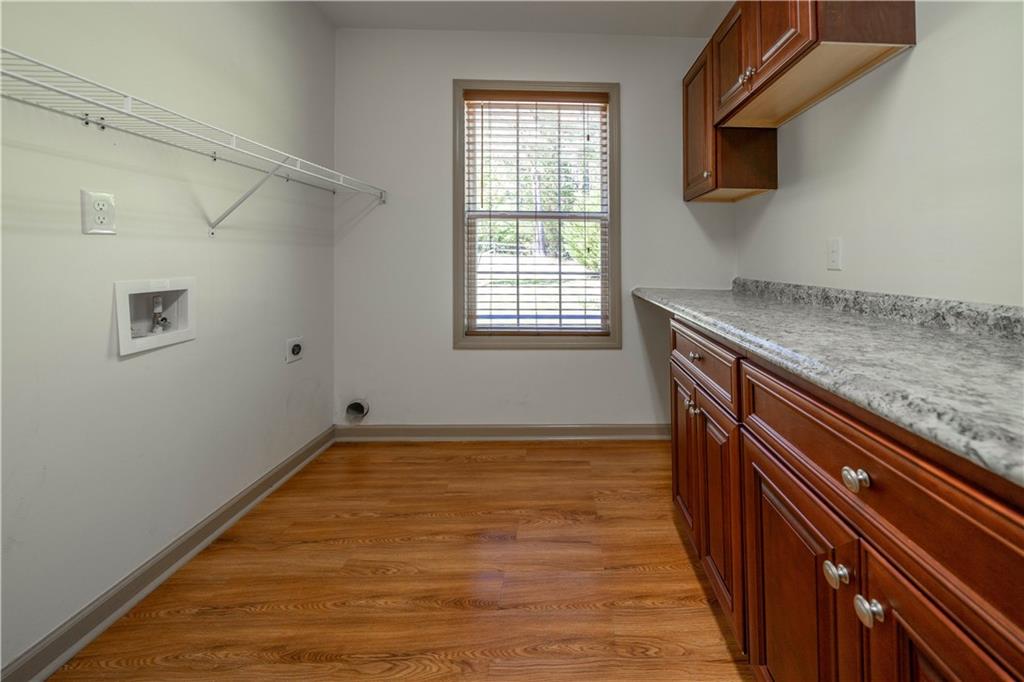 25 Quail Ridge Road Taylorsville, GA 30178 - Photo 14 of 29 a view of an empty room with wooden floor and a window