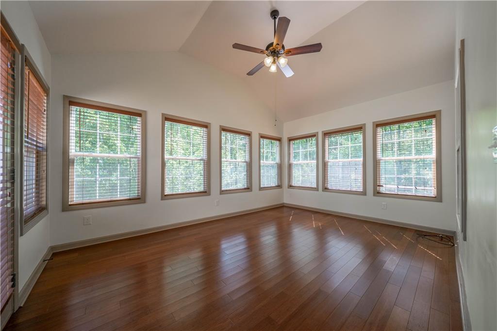25 Quail Ridge Road Taylorsville, GA 30178 - Photo 18 of 29 a view of an empty room with wooden floor and a window