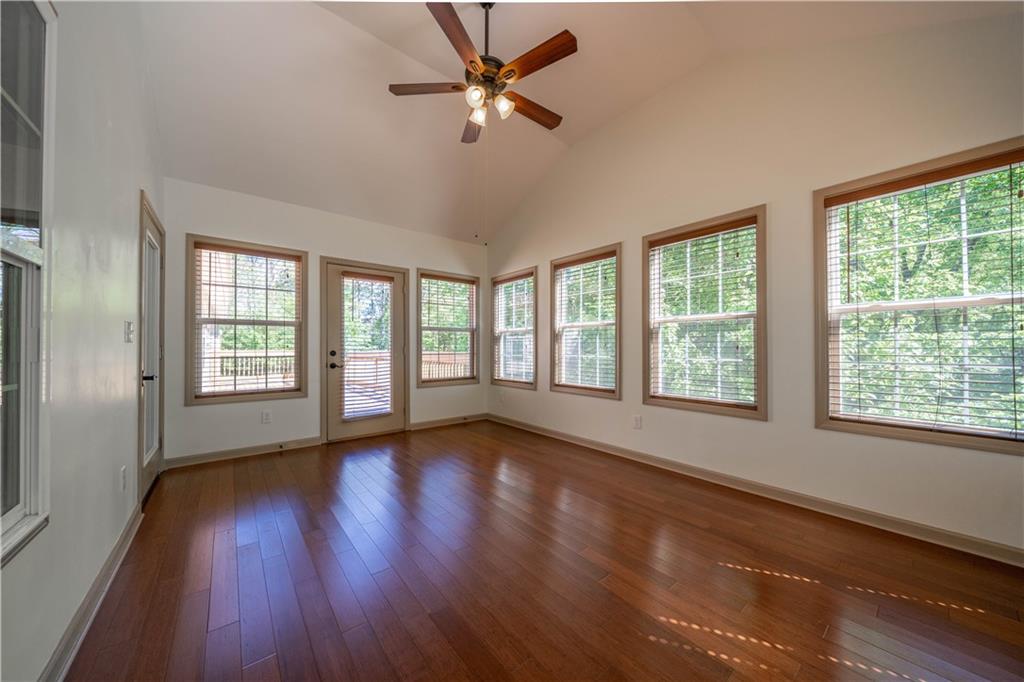 25 Quail Ridge Road Taylorsville, GA 30178 - Photo 19 of 29 a view of an empty room with wooden floor and a window