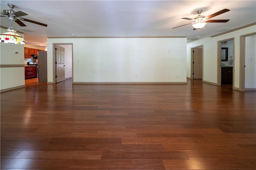 25 Quail Ridge Road Taylorsville, GA 30178 - Photo 2 of 29 a view of empty room with wooden floor and fan