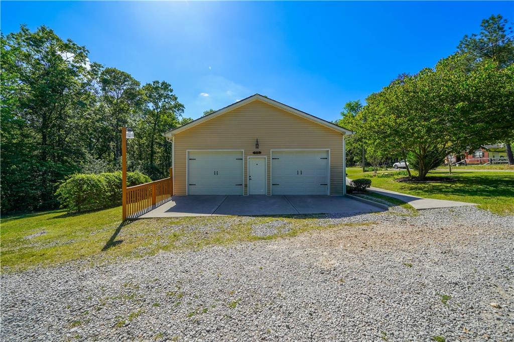 25 Quail Ridge Road Taylorsville, GA 30178 - Photo 25 of 29 a view of a house with backyard and trees