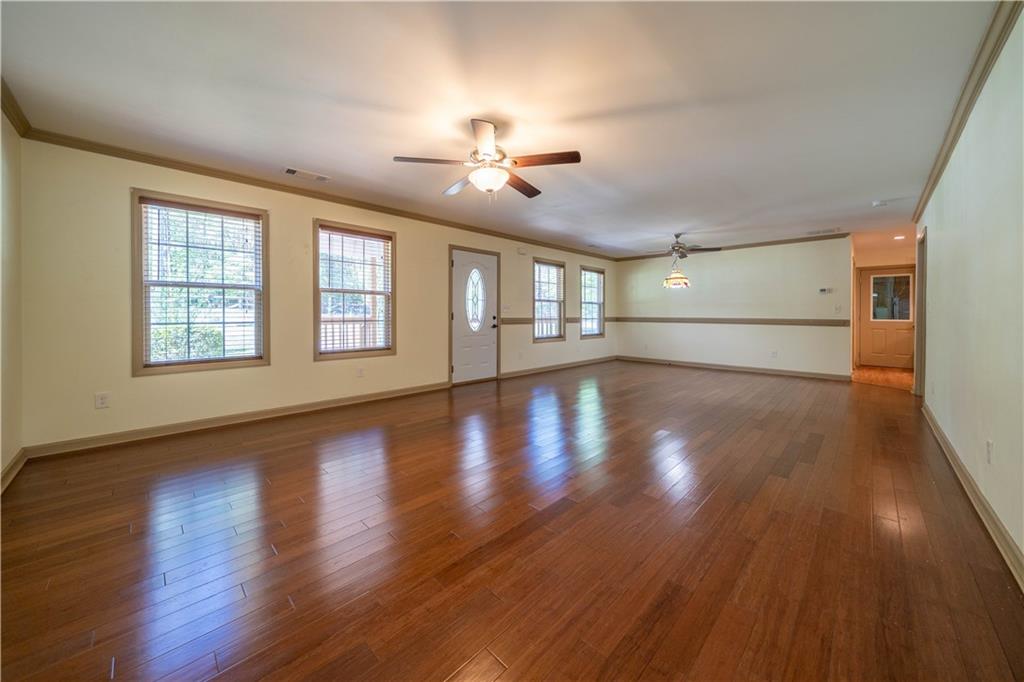 25 Quail Ridge Road Taylorsville, GA 30178 - Photo 4 of 29 a view of empty room with wooden floor and fan
