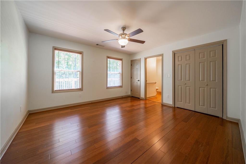 25 Quail Ridge Road Taylorsville, GA 30178 - Photo 8 of 29 a view of an empty room with wooden floor and a window