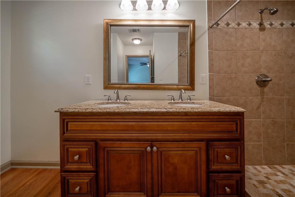 25 Quail Ridge Road Taylorsville, GA 30178 - Photo 9 of 29 a bathroom with a sink and a mirror
