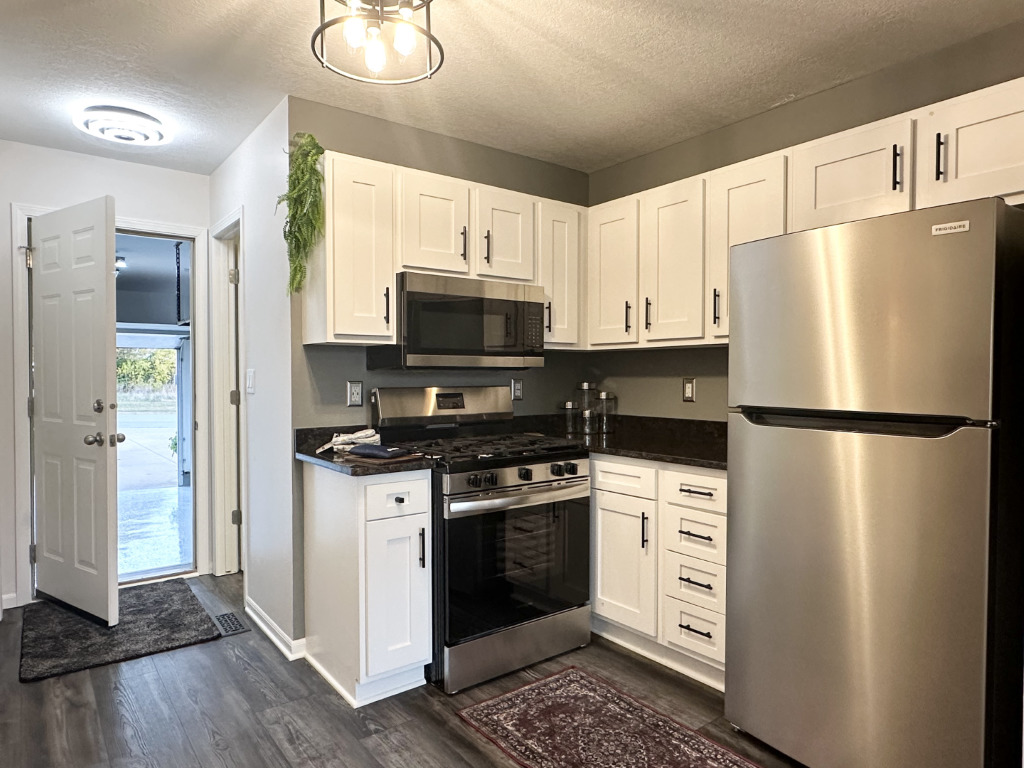 1514 Northfield Meadows Boulevard, Unit 2 Bourbonnais, IL 60914 - Photo 14 of 30 a kitchen with stainless steel appliances a refrigerator stove and microwave