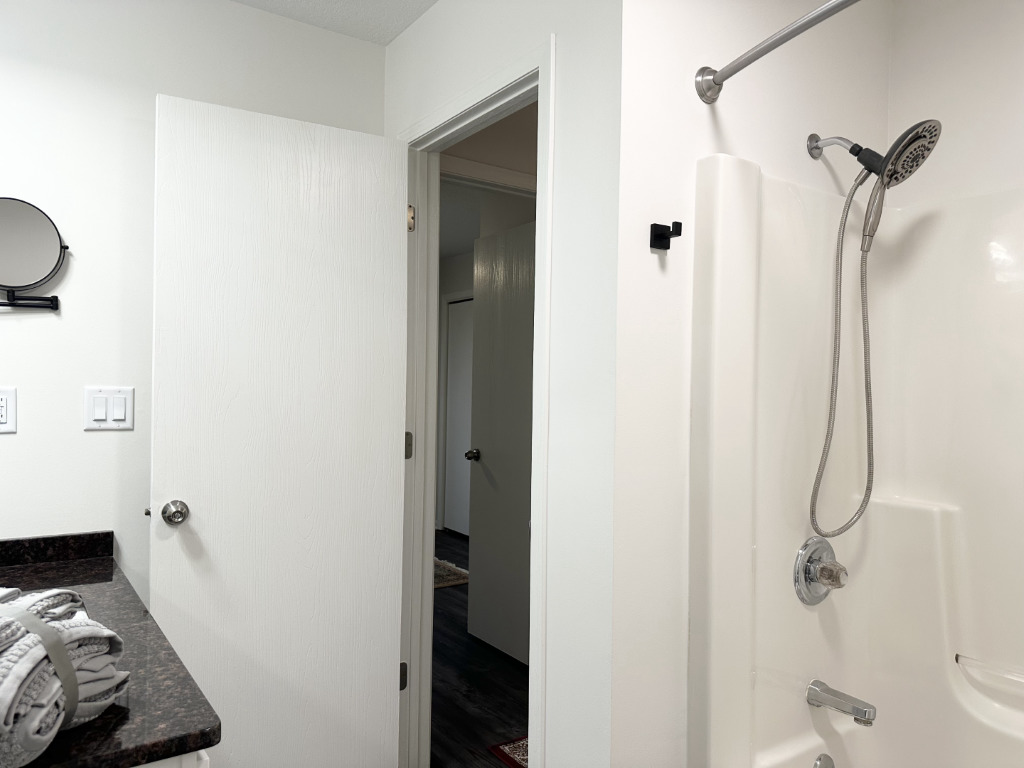 1514 Northfield Meadows Boulevard, Unit 2 Bourbonnais, IL 60914 - Photo 22 of 30 a bathroom with a sink and a shower