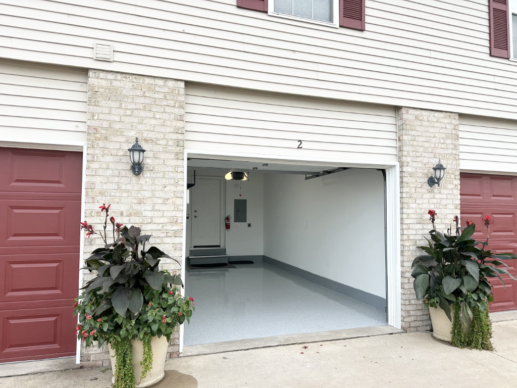 1514 Northfield Meadows Boulevard, Unit 2 Bourbonnais, IL 60914 - Photo 29 of 30 a potted plant sitting in front of a house