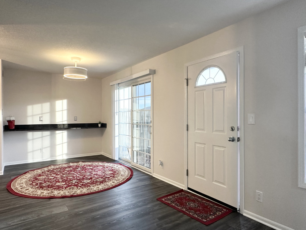 1514 Northfield Meadows Boulevard, Unit 2 Bourbonnais, IL 60914 - Photo 5 of 30 a view of room with window and wooden floor