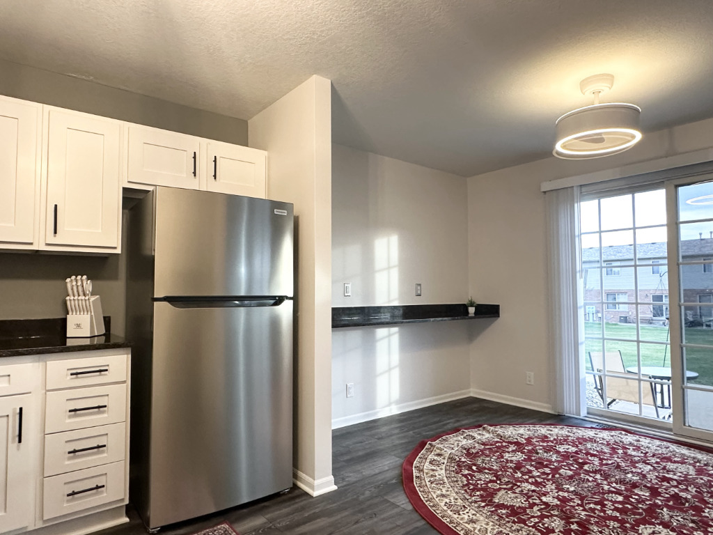 1514 Northfield Meadows Boulevard, Unit 2 Bourbonnais, IL 60914 - Photo 8 of 30 a kitchen with stainless steel appliances a refrigerator sink and cabinets