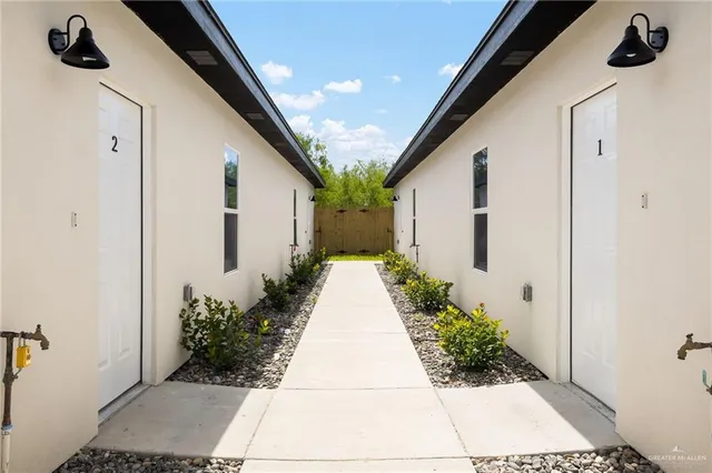 a view of a pathway front of house
