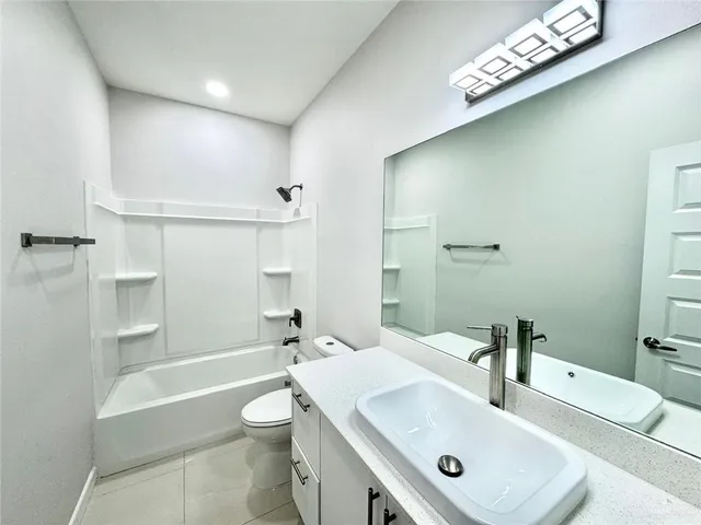 a bathroom with a toilet a sink and a bathtub