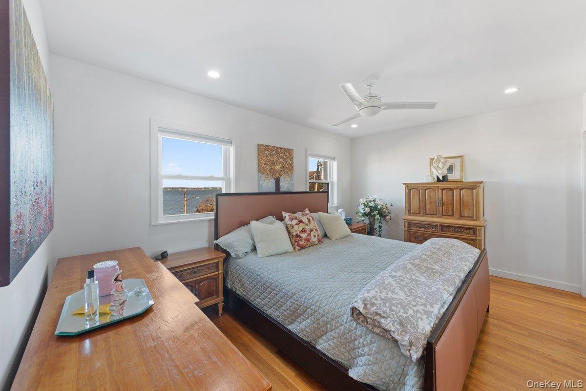 902 Dean Avenue Bronx, NY 10465 - Photo 15 of 40 a bedroom with a bed and ceiling fan