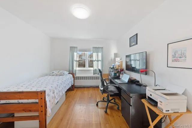 a bedroom with a workspace