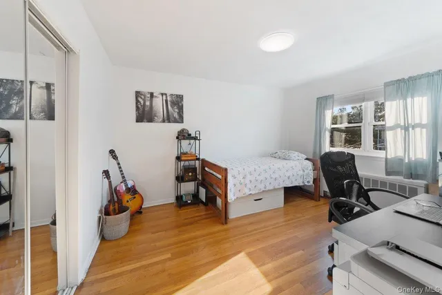 a bedroom with furniture and a gym equipment