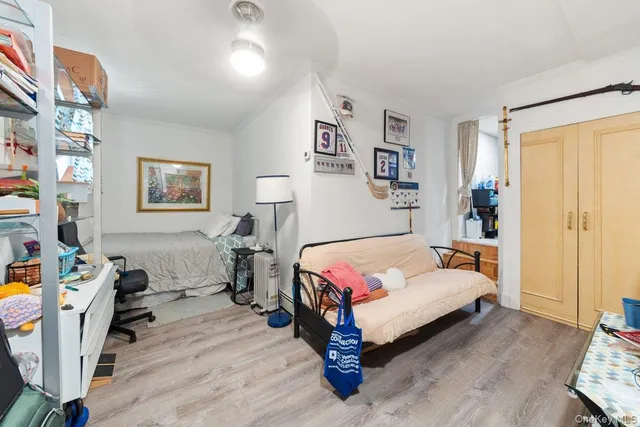 a bedroom with a bed furniture and a window