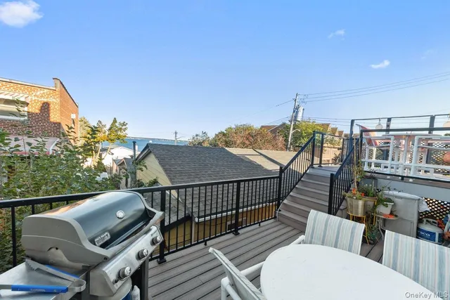 a view of a balcony with furniture