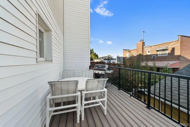 a view of a balcony with furniture