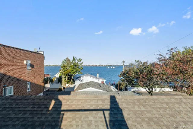 a outdoor dining space with furniture and city view