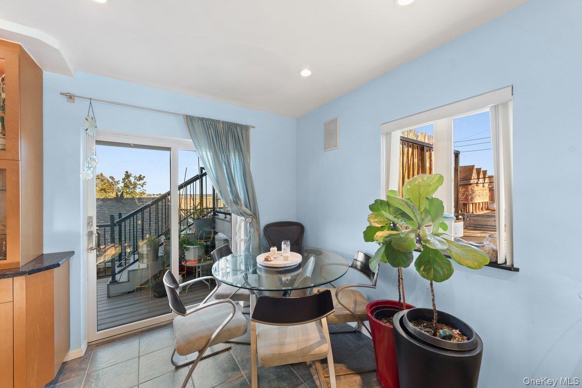 902 Dean Avenue Bronx, NY 10465 - Photo 8 of 40 a dining room filled with furniture and a potted plant