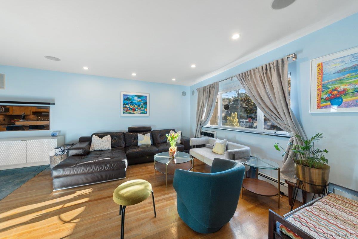 902 Dean Avenue Bronx, NY 10465 - Photo 10 of 40 a living room with furniture a couch and large window