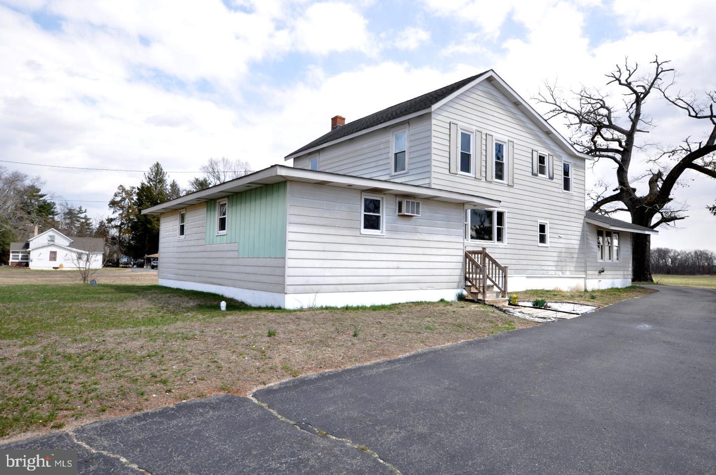 614 11th Street, Unit 2 Hammonton, NJ 08037 - Photo 2 of 12 a view of a house with backyard and trees