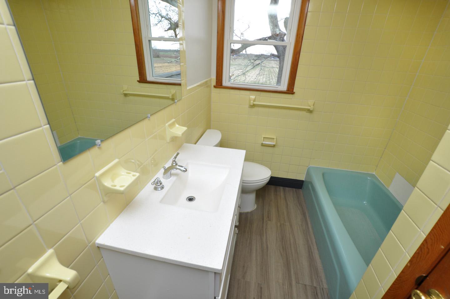 614 11th Street, Unit 2 Hammonton, NJ 08037 - Photo 7 of 12 a bathroom with a sink and a bathtub