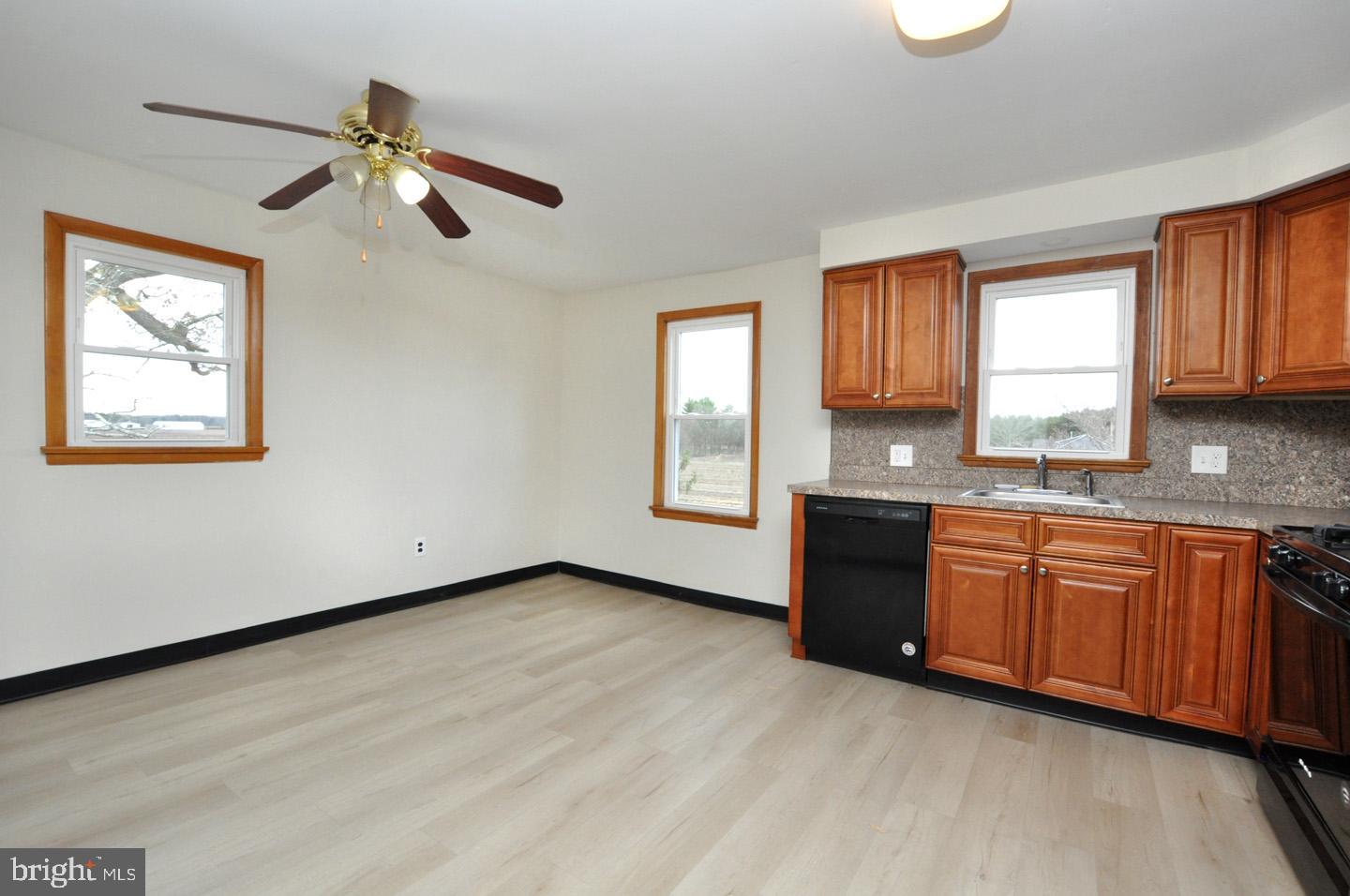 614 11th Street, Unit 2 Hammonton, NJ 08037 - Photo 8 of 12 a view of a kitchen with a sink cabinet and a dishwasher