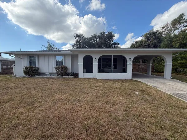 front view of a house with a yard