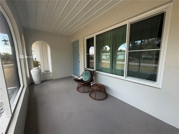 a view of a livingroom with furniture and windows