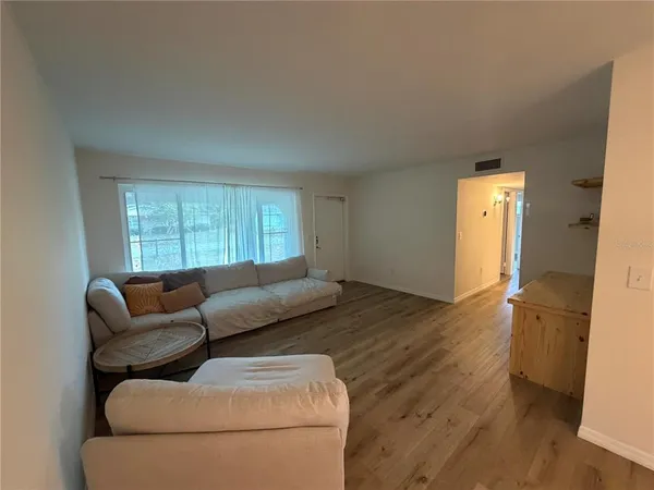 a living room with furniture and a window