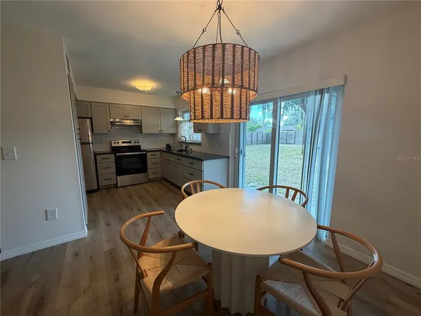 a view of a dining room with furniture window and outside view