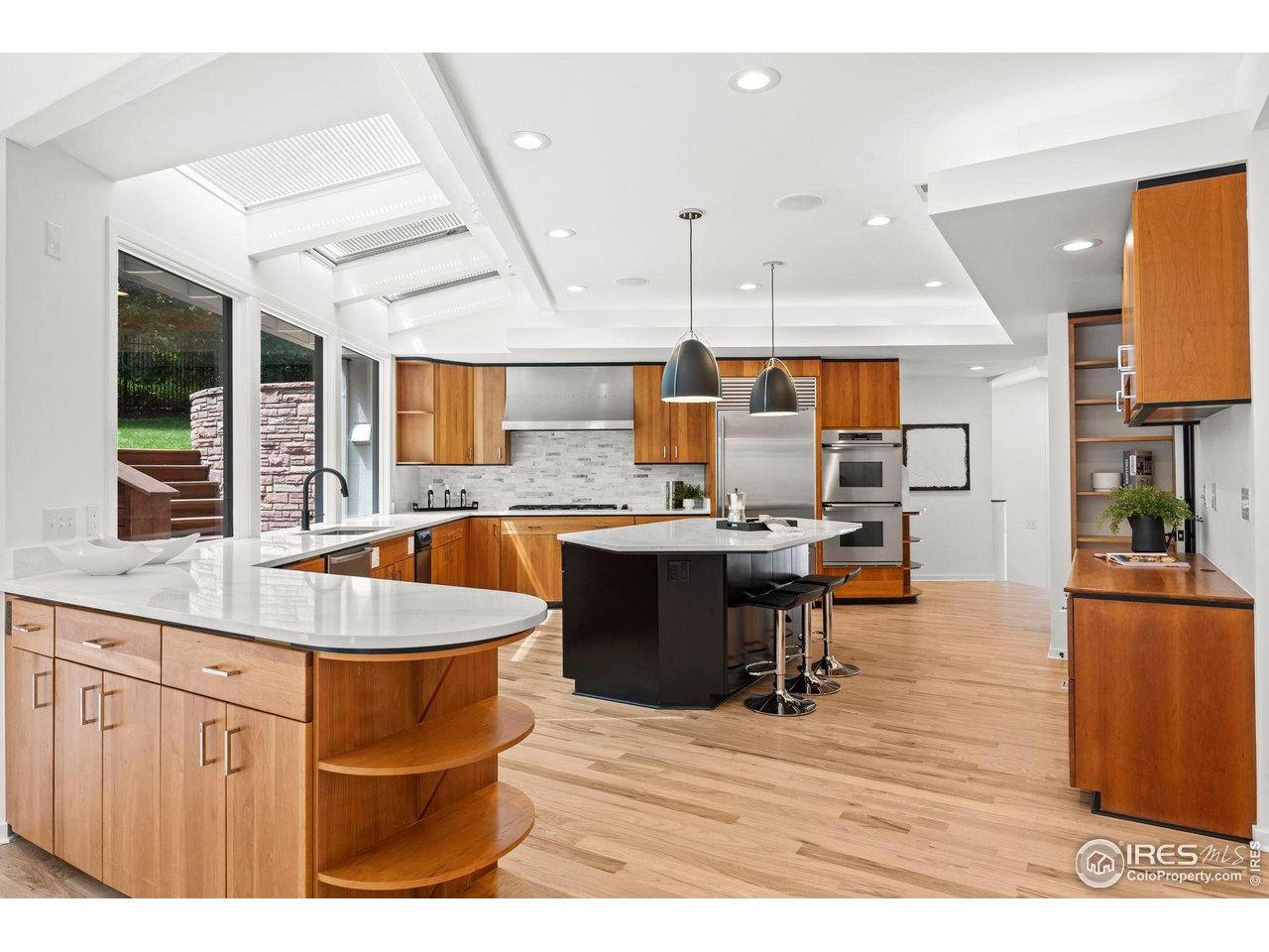 710 Willowbrook Road Boulder, CO 80302 - Photo 11 of 32 a large kitchen with stainless steel appliances kitchen island granite countertop a large counter top and view living room