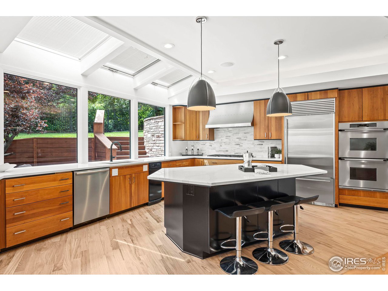 710 Willowbrook Road Boulder, CO 80302 - Photo 12 of 32 a kitchen with a sink a counter top space and stainless steel appliances