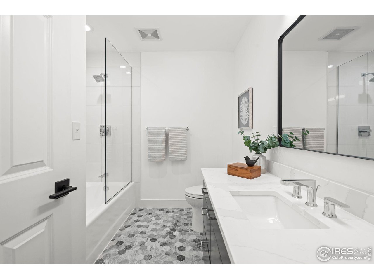 710 Willowbrook Road Boulder, CO 80302 - Photo 16 of 32 a bathroom with a sink toilet and shower